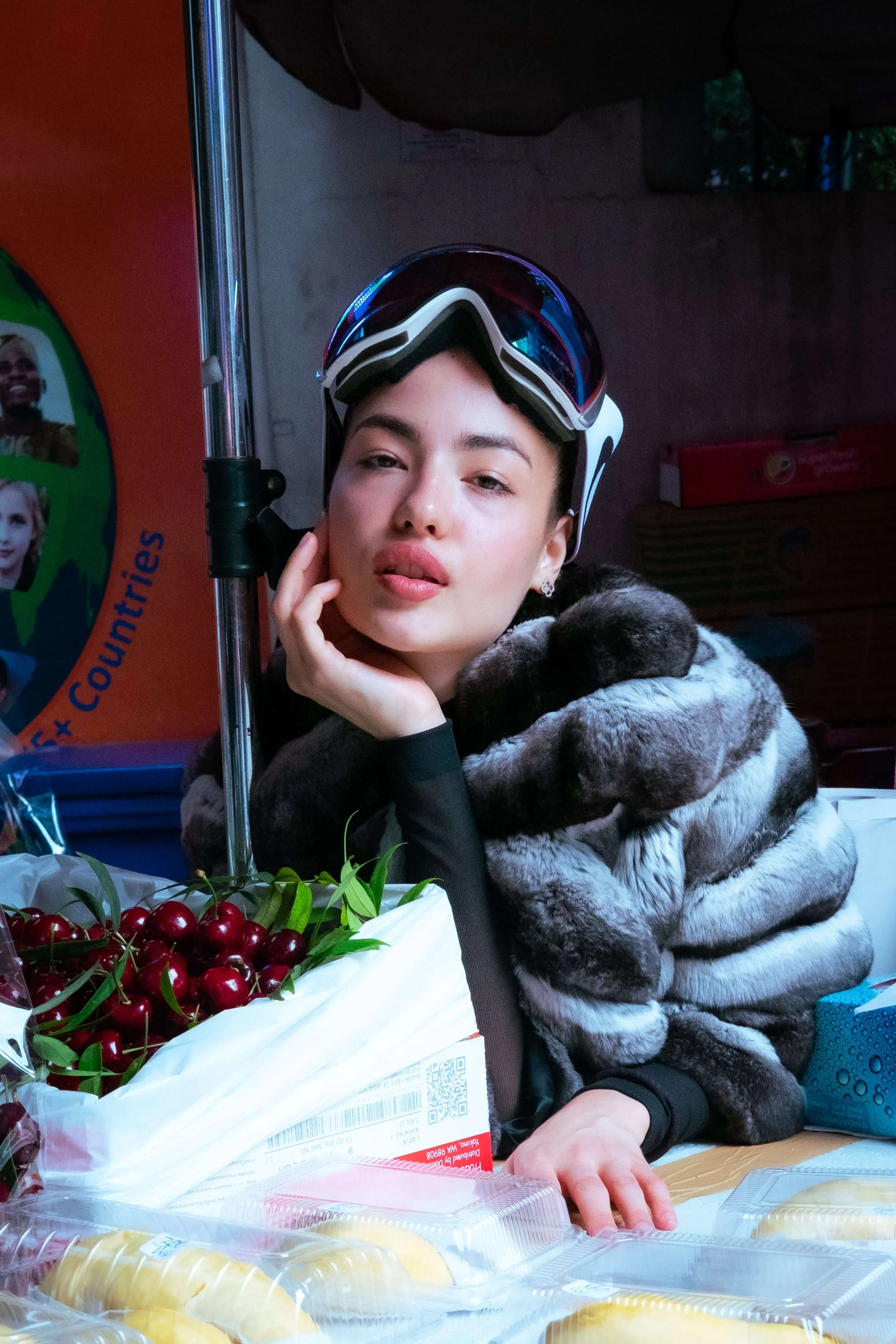 Girl in ski goggles and fur coat