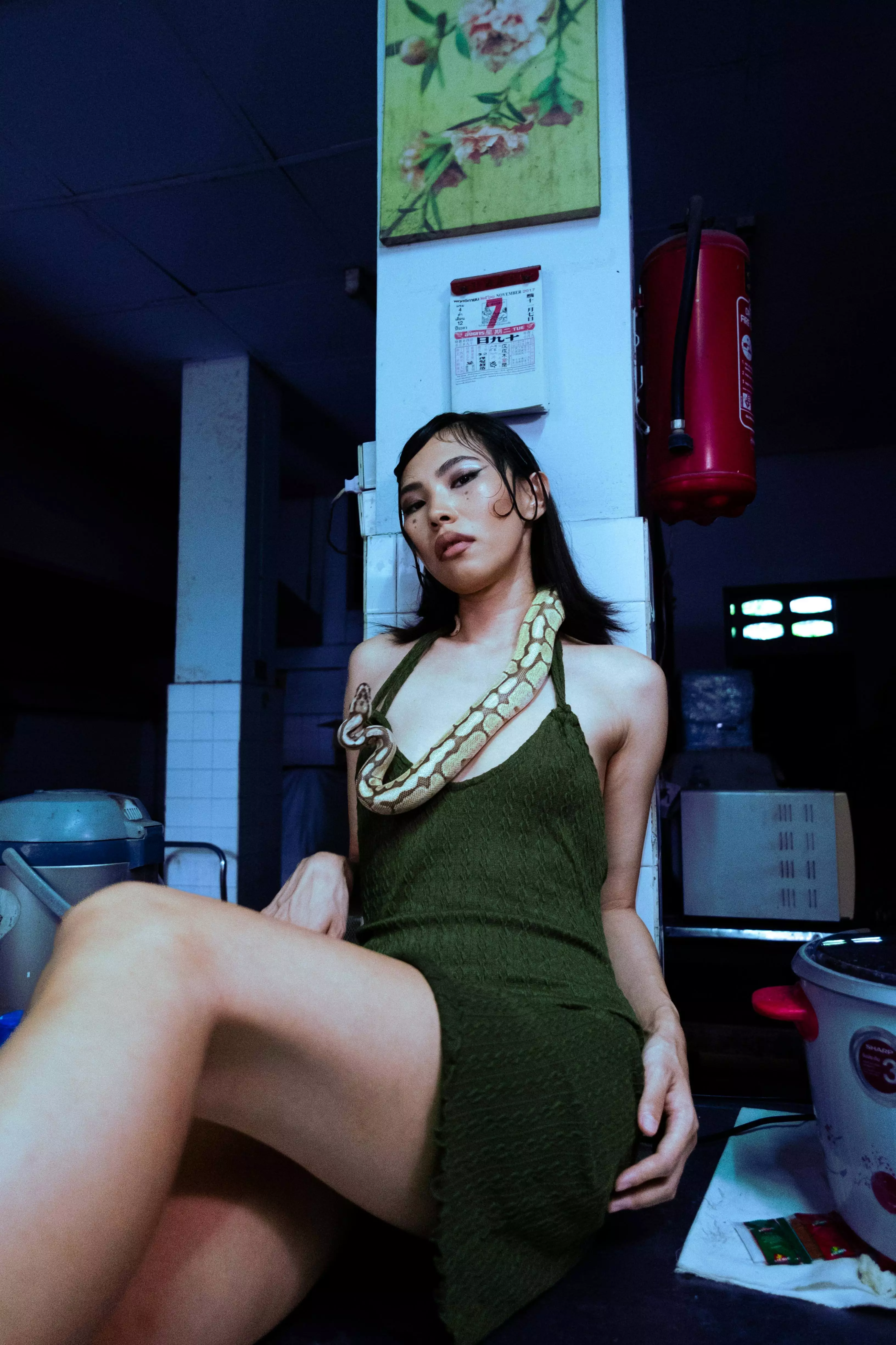 Girl laying on the floor wearing heels and a dress