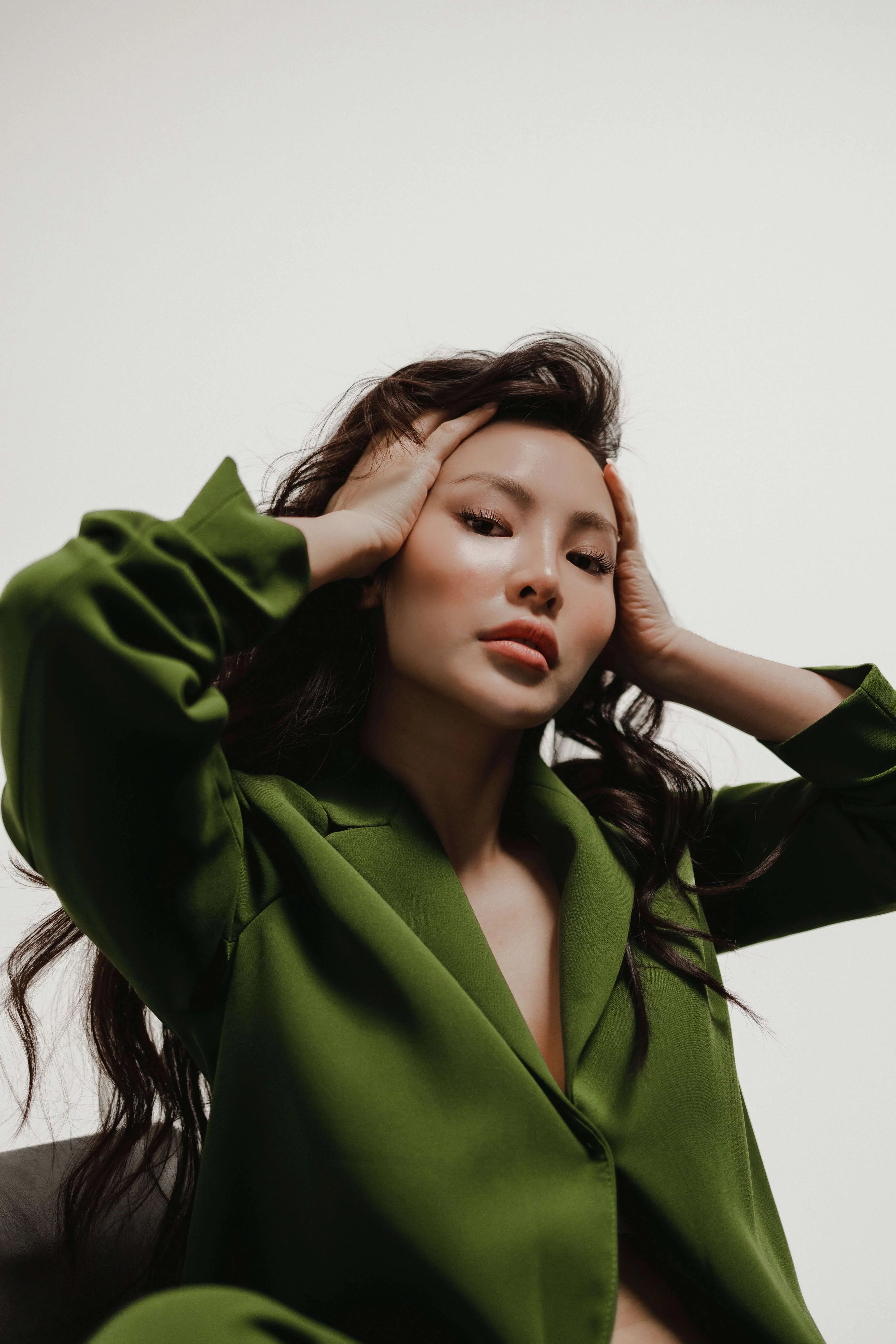 Portrait of a girl wearing a green blazer