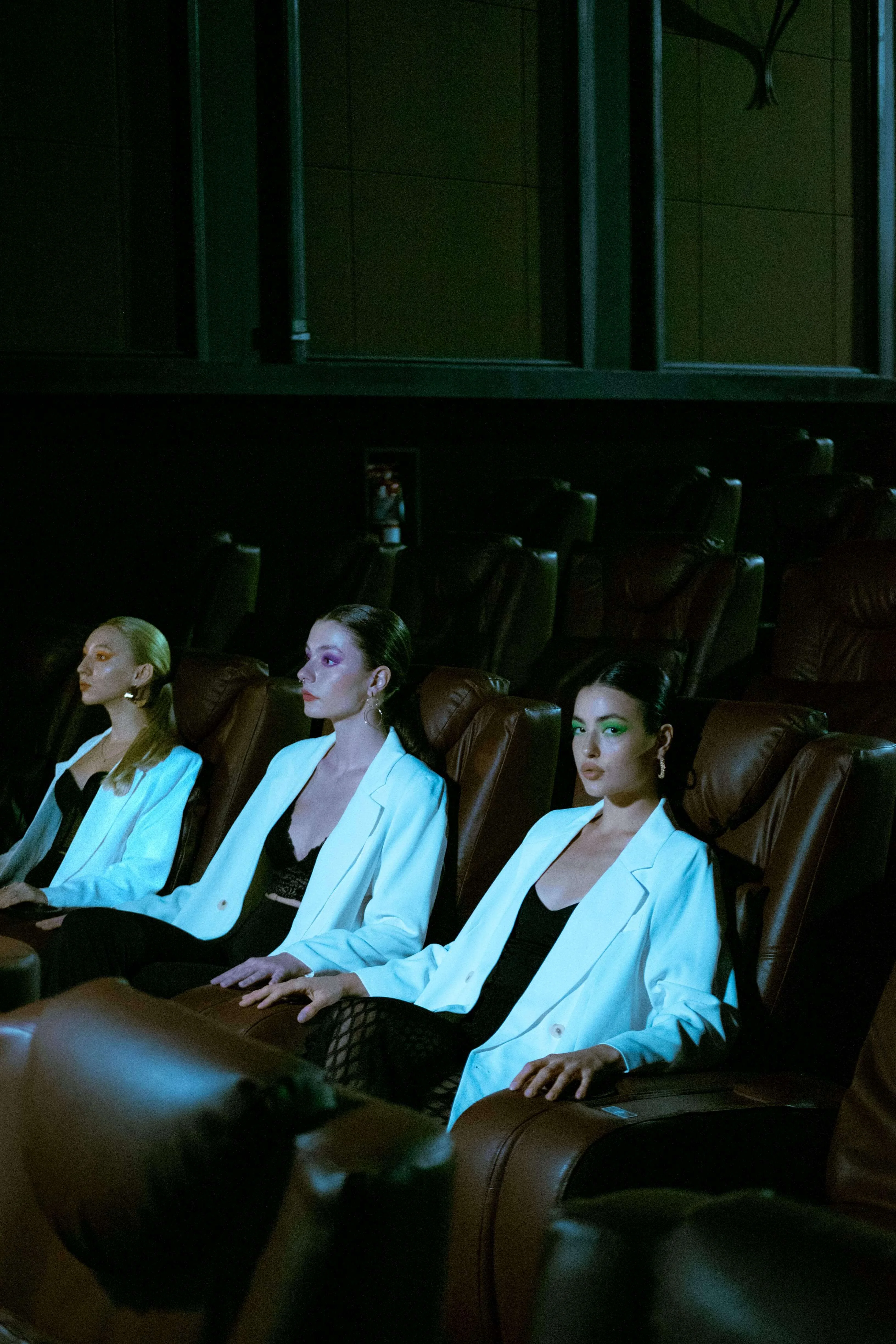 Three girls in a theater